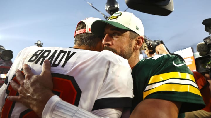 Sep 25, 2022; Tampa, Florida, USA; Tampa Bay Buccaneers quarterback Tom Brady (12) and Green Bay Packers quarterback Aaron Rodgers (12) greet after the game at Raymond James Stadium. 