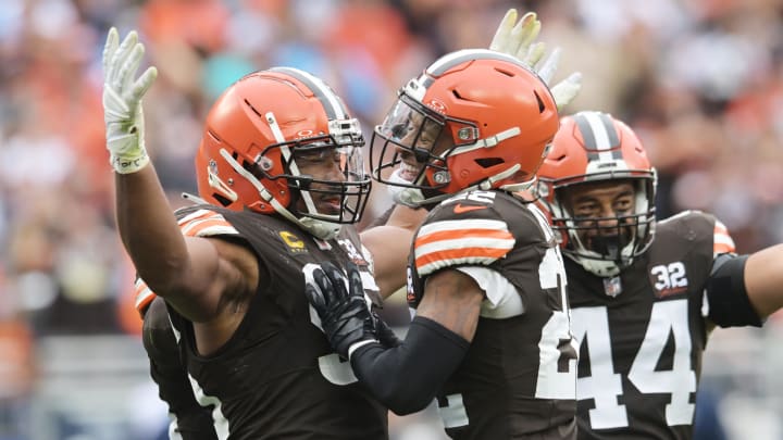 Sep 24, 2023; Cleveland, Ohio, USA; Cleveland Browns defensive end Myles Garrett (95) and safety Grant Delpit (22) and linebacker Sione Takitaki (44) celebrate after sacking Tennessee Titans quarterback Ryan Tannehill (not pictured) during the second half at Cleveland Browns Stadium. Mandatory Credit: Ken Blaze-USA TODAY Sports