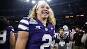 Dec 26, 2024; Phoenix, AZ, USA; Kansas State Wildcats quarterback Avery Johnson (2) celebrates after defeating the Rutgers Scarlet Knights during the Rate Bowl at Chase Field.