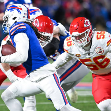 Jan 21, 2024; Orchard Park, New York, USA;Kansas City Chiefs defensive end George Karlaftis (56) and Buffalo Bills running back James Cook (4)  in the first half of a 2024 AFC divisional round game at Highmark Stadium. Mandatory Credit: Mark Konezny-USA TODAY Sports