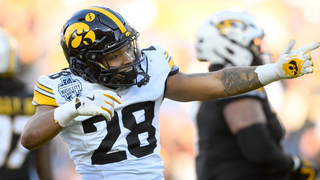 Dec 30, 2024; Nashville, TN, USA;  Iowa Hawkeyes running back Kamari Moulton (28) celebrates his first down against the Missouri Tigers during the first half at Nissan Stadium. Mandatory Credit: Steve Roberts-Imagn Images