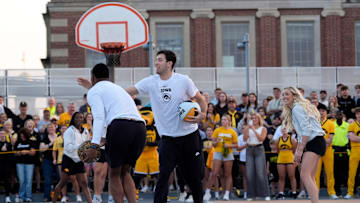 Iowa men's basketball player Alvaro Folgueiras tries to disrupt teammate Cam ManyawuÕs shot as the pair compete in a shooting competition during the Hawkeye Hoops from Downtown event Oct. 17, 2025 on the University of Iowa campus in Iowa City, Iowa.