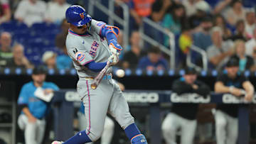 Sep 28, 2025; Miami, Florida, USA; New York Mets designated hitter Mark Vientos (27) hits a single against the Miami Marlins during the sixth inning at loanDepot Park. Mandatory Credit: Sam Navarro-Imagn Images