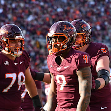Nov 1, 2025; Blacksburg, Virginia, USA; Virginia Tech Hokies offensive lineman Johnny Garrett (79) celebrates a touchdown by Virginia Tech Hokies wide receiver Cameron Seldon (9) during the second quarter at Lane Stadium. Mandatory Credit: Brian Bishop-Imagn Images