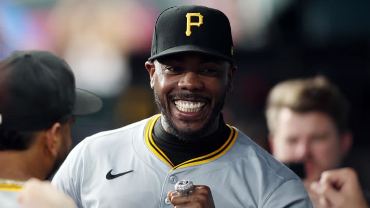 Pittsburgh Pirates pitcher Aroldis Chapman (45) smiles in the dugout after receiving his World Series ring before the game against the Texas Rangers at Globe Life Field on Aug 19.