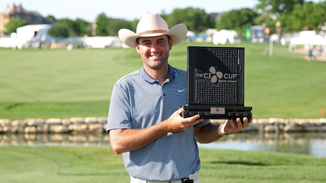 Scottie Scheffler poses with the winner's trophy following his victory at the 2025 CJ Cup Byron Nelson