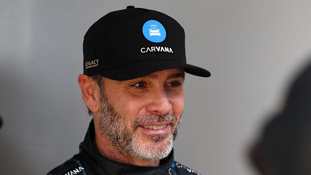 Jimmie Johnson (84) walks to the drivers meeting before the Daytona 500 at Daytona International Speedway. 