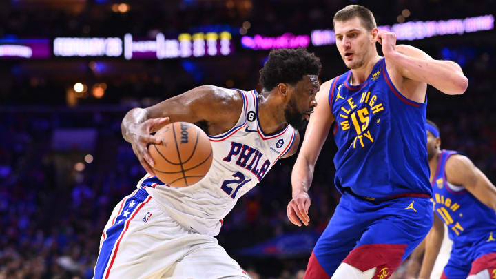 Jan 28, 2023; Philadelphia, Pennsylvania, USA; Philadelphia 76ers center Joel Embiid (21) drives against Denver Nuggets center Nikola Jokic (15) in the third quarter at Wells Fargo Center. Mandatory Credit: Kyle Ross-USA TODAY Sports