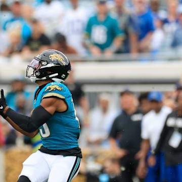 Jacksonville Jaguars wide receiver Christian Kirk (13) hauls in a reception as Indianapolis Colts safety Julian Blackmon (32) looks on during the fourth quarter of an NFL football matchup Sunday, Oct. 6, 2024 at EverBank Stadium in Jacksonville, Fla. The Jaguars edged the Colts on a field goal 37-34. 