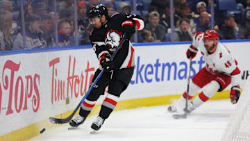 Apr 8, 2025; Buffalo, New York, USA;  Buffalo Sabres defenseman Connor Clifton (75) clears the puck during the third period against the Carolina Hurricanes at KeyBank Center. Mandatory Credit: Timothy T. Ludwig-Imagn Images
