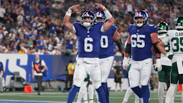 Aug 16, 2025; East Rutherford, New Jersey, USA; New York Giants quarterback Jaxson Dart (6) celebrates his rushing touchdown during the second half against the New York Jets at MetLife Stadium. Mandatory Credit: Vincent Carchietta-Imagn Images