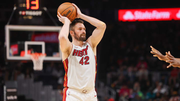 Apr 9, 2024; Atlanta, Georgia, USA; Miami Heat forward Kevin Love (42) passes the ball against the Atlanta Hawks in the first quarter at State Farm Arena. Mandatory Credit: Brett Davis-USA TODAY Sports