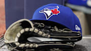 Jun 18, 2025; Toronto, Ontario, CAN; A Toronto Blue Jays cap and glove sits in the dugout during a game against the Arizona Diamondbacks at Rogers Centre. Mandatory Credit: John E. Sokolowski-Imagn Images