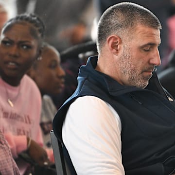 Mar 13, 2025; Foxborough, MA, USA; New England Patriots head coach Mike Vrabel takes notes at a press conference at the GP Atrium at Gillette Stadium. Mandatory Credit: Eric Canha-Imagn Images