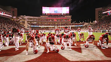 Nov 18, 2023; Fayetteville, Arkansas, USA; Arkansas Razorbacks players take a knee prior to the game against the FIU Panthers at Donald W. Reynolds Razorback Stadium. Arkansas won 44-20. Mandatory Credit: Nelson Chenault-USA TODAY Sports