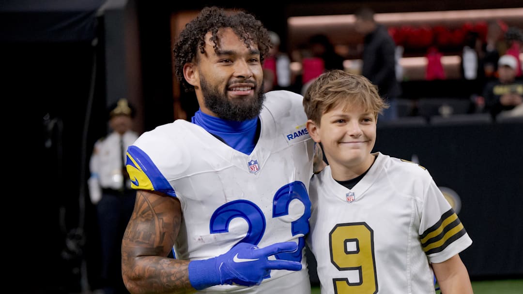 Dec 1, 2024; New Orleans, Louisiana, USA; Los Angeles Rams running back Kyren Williams (23) greets a fan before a game against the New Orleans Saints at Caesars Superdome. Mandatory Credit: Matthew Hinton-Imagn Images Dec 1, 2024; New Orleans, Louisiana, USA; Los Angeles Rams running back Kyren Williams (23) greets a fan before a game against the New Orleans Saints at Caesars Superdome. Mandatory Credit: Matthew Hinton-Imagn Images