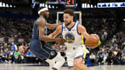 Mar 22, 2023; Dallas, Texas, USA; Dallas Mavericks forward Justin Holiday (0) and Golden State Warriors guard Klay Thompson (11) in action during the game between the Dallas Mavericks and the Golden State Warriors at the American Airlines Center. Mandatory Credit: Jerome Miron-USA TODAY Sports