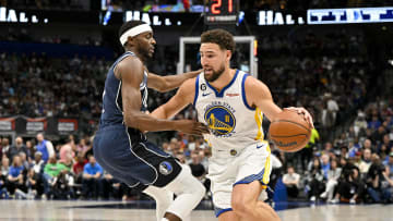 Mar 22, 2023; Dallas, Texas, USA; Dallas Mavericks forward Justin Holiday (0) and Golden State Warriors guard Klay Thompson (11) in action during the game between the Dallas Mavericks and the Golden State Warriors at the American Airlines Center. Mandatory Credit: Jerome Miron-USA TODAY Sports