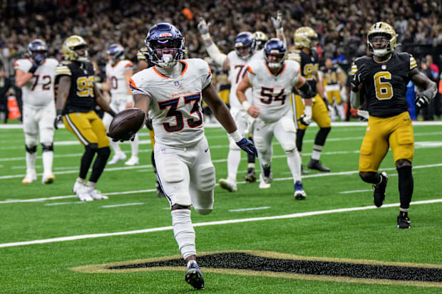 Denver Broncos running back Javonte Williams scores a touchdown against the New Orleans Saints.