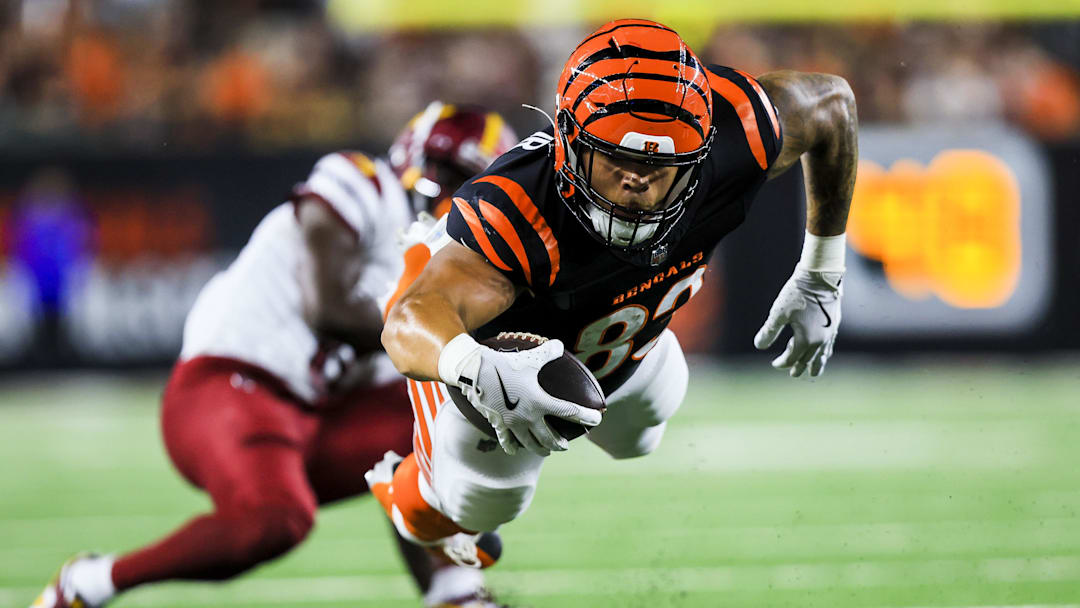 Sep 23, 2024; Cincinnati, Ohio, USA; Cincinnati Bengals tight end Erick All Jr. (83) advances the ball against the Washington Commanders in the first half at Paycor Stadium. Mandatory Credit: Katie Stratman-Imagn Images