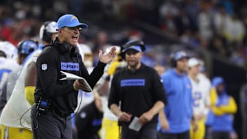 Jan 11, 2025; Houston, Texas, USA; Los Angeles Chargers head coach Jim Harbaugh reacts during the third quarter against the Houston Texans in an AFC wild card game at NRG Stadium. 
