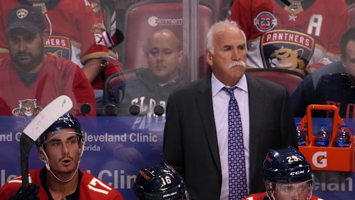 Oct 27, 2021; Sunrise, Florida, USA; Florida Panthers head coach Joel Quenneville stands behind the bench during the first period between the Florida Panthers and the Boston Bruins at FLA Live Arena. Mandatory Credit: Jasen Vinlove-Imagn Images