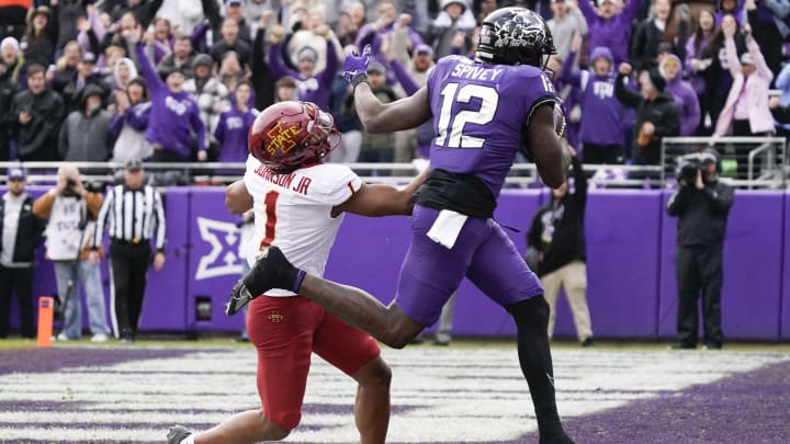 Nov 26, 2022; Fort Worth, Texas, USA; TCU Horned Frogs tight end Geor'Quarius Spivey (12) makes the 19-yard touch catch defended by Iowa State Cyclones defensive back Anthony Johnson Jr. (1) during first half at Amon G. Carter Stadium. Mandatory Credit: Raymond Carlin III-USA TODAY Sports