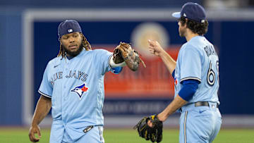 Apr 30, 2022; Toronto, Ontario, CAN; Toronto Blue Jays first baseman Vladimir Guerrero Jr. (27) celebrates with teammate starting pitcher Jordan Romano (68) after defeating the Houston Astros at Rogers Centre. Mandatory Credit: Kevin Sousa-Imagn Images