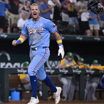 Sep 1, 2024; Arlington, Texas, USA; Texas Rangers third baseman Josh Jung (6) celebrates after he hits a game winning three run walk-off home run during the tenth inning off of Oakland Athletics relief pitcher Mason Miller (19) at Globe Life Field. Mandatory Credit: Jerome Miron-USA TODAY Sports