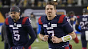 Nov 19, 2023; Hamilton, Ontario, CAN; Montreal Alouettes quarterback Caleb Evans (5) and Montreal Alouettes quarterback Cody Fajardo (7) during warm up before the game against the Winnipeg Blue Bombers  at Tim Hortons Field. Mandatory Credit: John E. Sokolowski-Imagn Images