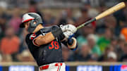 Jul 22, 2024; Minneapolis, Minnesota, USA; Minnesota Twins third baseman Diego A. Castillo (39) hits a ground rule double against the Philadelphia Phillies in the fifth inning at Target Field. Mandatory Credit: Jesse Johnson-Imagn Images
