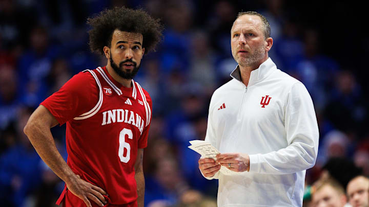 Dec 13, 2025; Lexington, Kentucky, USA; Indiana Hoosiers head coach Darian Devries talks with guard Tayton Conerway (6) during the first half against the Kentucky Wildcats at Rupp Arena at Central Bank Center. Mandatory Credit: Jordan Prather-Imagn Images