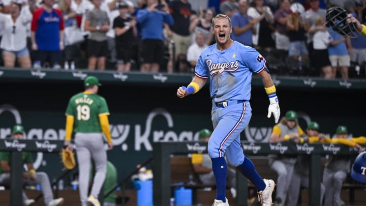 Sep 1, 2024; Arlington, Texas, USA; Texas Rangers third baseman Josh Jung (6) celebrates after he hits a game winning three run walk-off home run during the tenth inning off of Oakland Athletics relief pitcher Mason Miller (19) at Globe Life Field.