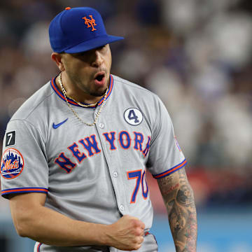 Jun 2, 2025; Los Angeles, California, USA; New York Mets pitcher Jose Butto (70) reacts after defeating the Los Angeles Dodgers at Dodger Stadium. Mandatory Credit: Jason Parkhurst-Imagn Images