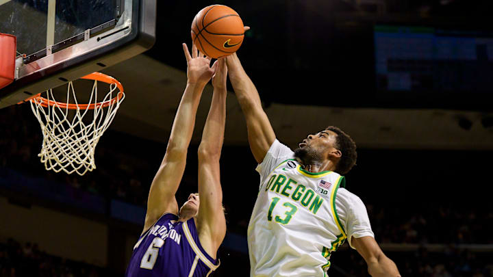 Oregon forward Sean Stewart, right, rebounds over Washington forward Hannes Steinbach as the Oregon Ducks host the Washington Huskies on March 7, 2026, at Matthew Knight Arena in Eugene, Oregon.