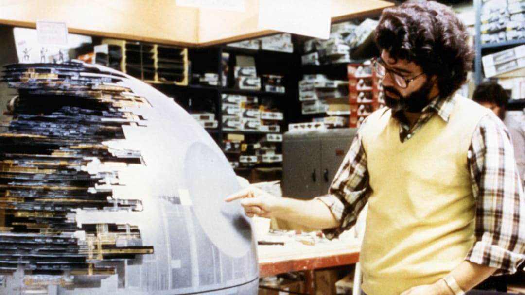 George Lucas on set of Star Wars: A New Hope with Death Star model