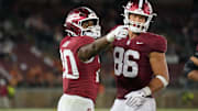 Sep 13, 2025; Stanford, California, USA; Stanford Cardinal running back Micah Ford (left) gestures with tight end Sam Roush (86) after carrying the ball for a first down against the Boston College Eagles during the fourth quarter at Stanford Stadium. Mandatory Credit: Darren Yamashita-Imagn Images