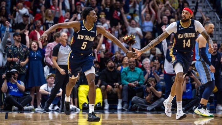 Apr 5, 2023; New Orleans, Louisiana, USA;  New Orleans Pelicans forward Herbert Jones (5) celebrates with forward Brandon Ingram (14) after making a three point basket against the Memphis Grizzlies during the second half at Smoothie King Center.