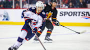 Jan 25, 2024; Calgary, Alberta, CAN; Columbus Blue Jackets left wing Johnny Gaudreau (13) controls the puck against the Calgary Flames during the second period at Scotiabank Saddledome. Mandatory Credit: Sergei Belski-Imagn Images