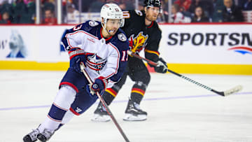 Jan 25, 2024; Calgary, Alberta, CAN; Columbus Blue Jackets left wing Johnny Gaudreau (13) controls the puck against the Calgary Flames during the second period at Scotiabank Saddledome. Mandatory Credit: Sergei Belski-Imagn Images