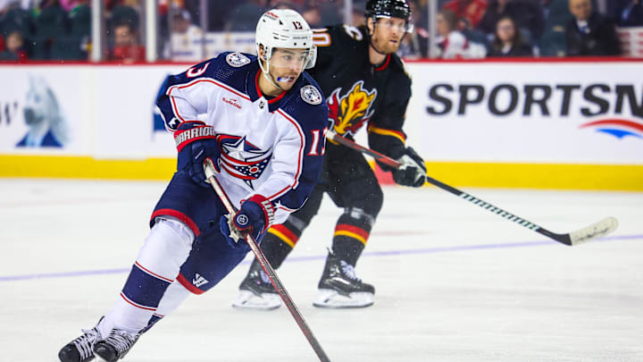 Jan 25, 2024; Calgary, Alberta, CAN; Columbus Blue Jackets left wing Johnny Gaudreau (13) controls the puck against the Calgary Flames during the second period at Scotiabank Saddledome. Mandatory Credit: Sergei Belski-Imagn Images