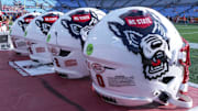 Sep 7, 2024; Charlotte, North Carolina, USA; North Carolina State Wolfpack helmets during pregame activity for the Dukes Mayo Classic against the Tennessee Volunteers at Bank of America Stadium. Mandatory Credit: Jim Dedmon-Imagn Images