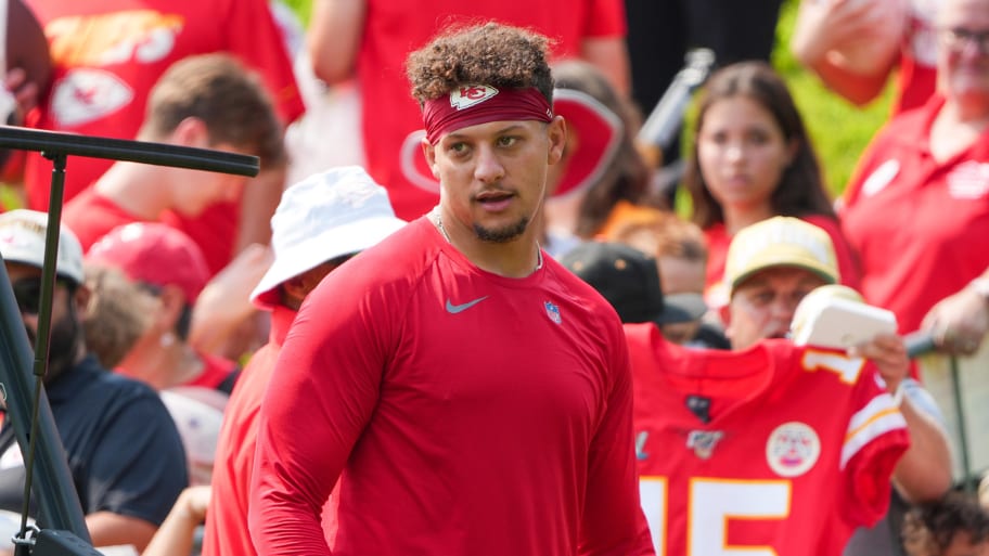 Jul 22, 2024; St. Joseph, MO, USA; Kansas City Chiefs quarterback Patrick Mahomes (15) signs autographs for fans after training camp at Missouri Western State University. Mandatory Credit: Denny Medley-USA TODAY Sports | Denny Medley-USA TODAY Sports