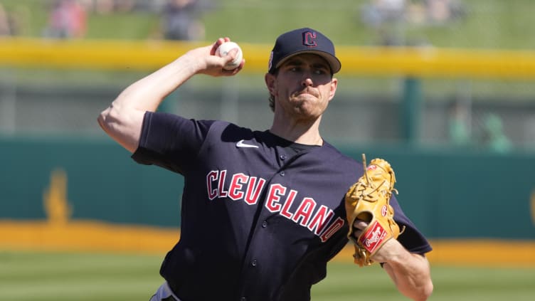 Cleveland Guardians starting pitcher Shane Bieber (57) throws