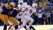 Nov 23, 2024; Berkeley, California, USA; Stanford Cardinal quarterback Justin Lamson (8) rushes for a touchdown against the California Golden Bears during the first quarter at California Memorial Stadium. Mandatory Credit: Darren Yamashita-Imagn Images