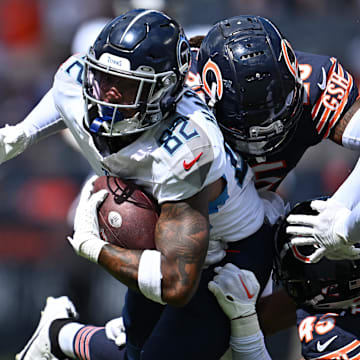 Aug 12, 2023; Chicago, Illinois, USA;  Tennessee Titans wide receiver Tre'Shaun Harrison (82) is tackled by Chicago Bears defensive back Macon Clark (25) and defensive back Bralen Trahan (45) in the second half at Soldier Field. Mandatory Credit: Jamie Sabau-Imagn Images