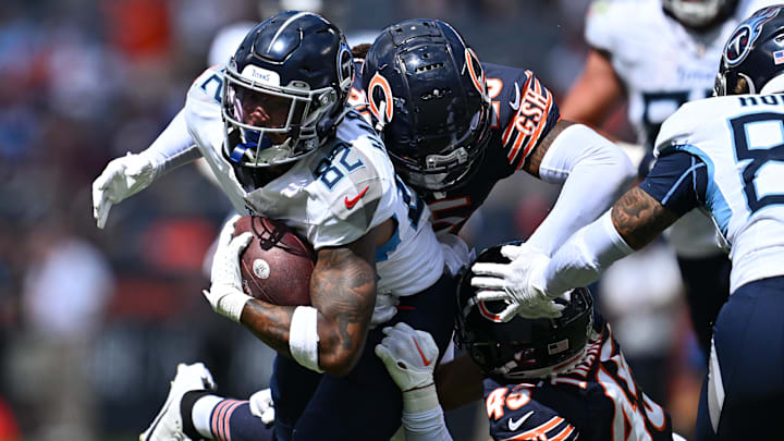 Aug 12, 2023; Chicago, Illinois, USA;  Tennessee Titans wide receiver Tre'Shaun Harrison (82) is tackled by Chicago Bears defensive back Macon Clark (25) and defensive back Bralen Trahan (45) in the second half at Soldier Field. Mandatory Credit: Jamie Sabau-Imagn Images