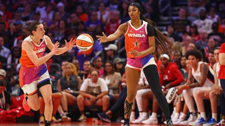 Jul 20, 2024; Phoenix, AZ, USA; Team WNBA forward Angel Reese (5) passes the ball to Team WNBA guard Caitlin Clark (22) during the first half against the USA Women's National Team at Footprint Center. Mandatory Credit: Mark J. Rebilas-USA TODAY Sports