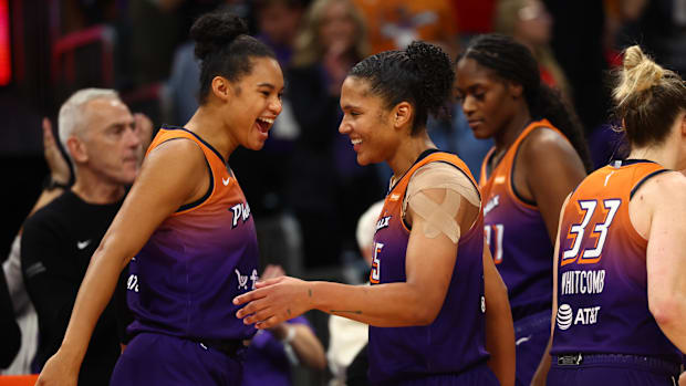 A photo of Alyssa Thomas and Satou Sabally celebrating