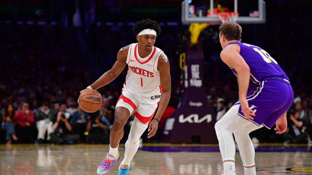 Apr 29, 2026; Los Angeles, California, USA; Houston Rockets guard Amen Thompson (1) moves the ball against Los Angeles Lakers guard Luke Kennard (10) during the second half in game five of the first round of the 2026 NBA Playoffs at Crypto.com Arena. Mandatory Credit: Gary A. Vasquez-Imagn Images